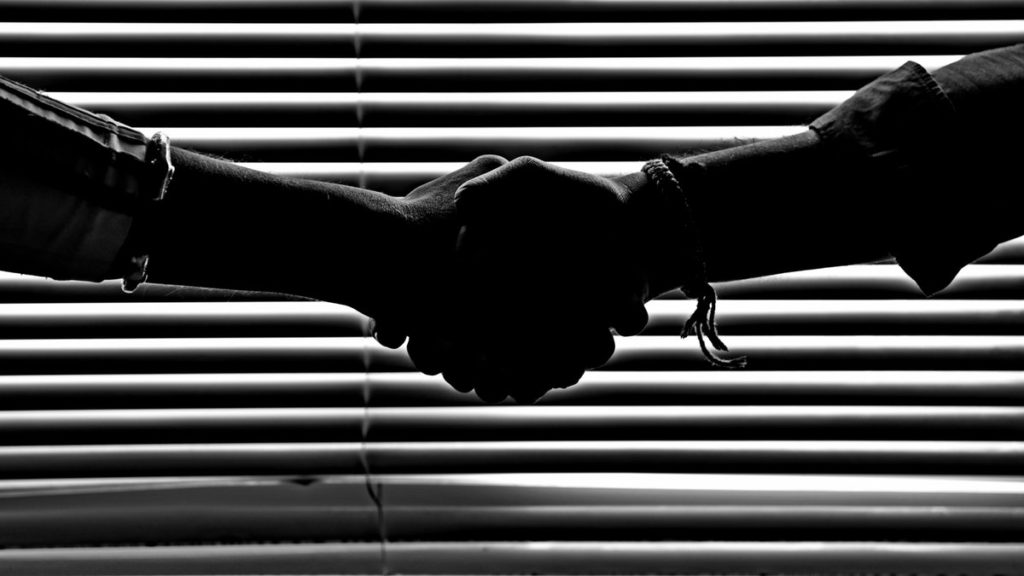 settlement loans - shaking hands