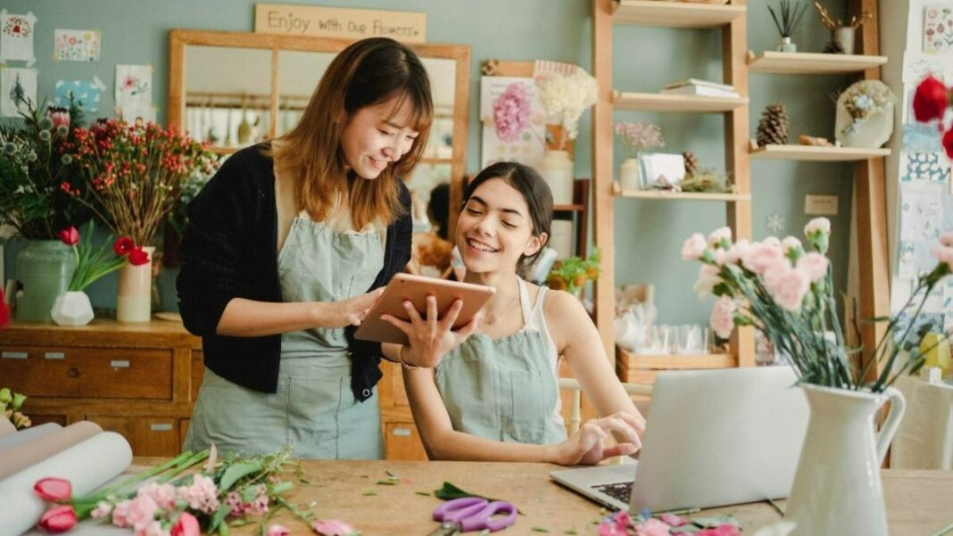 two women running a floral business