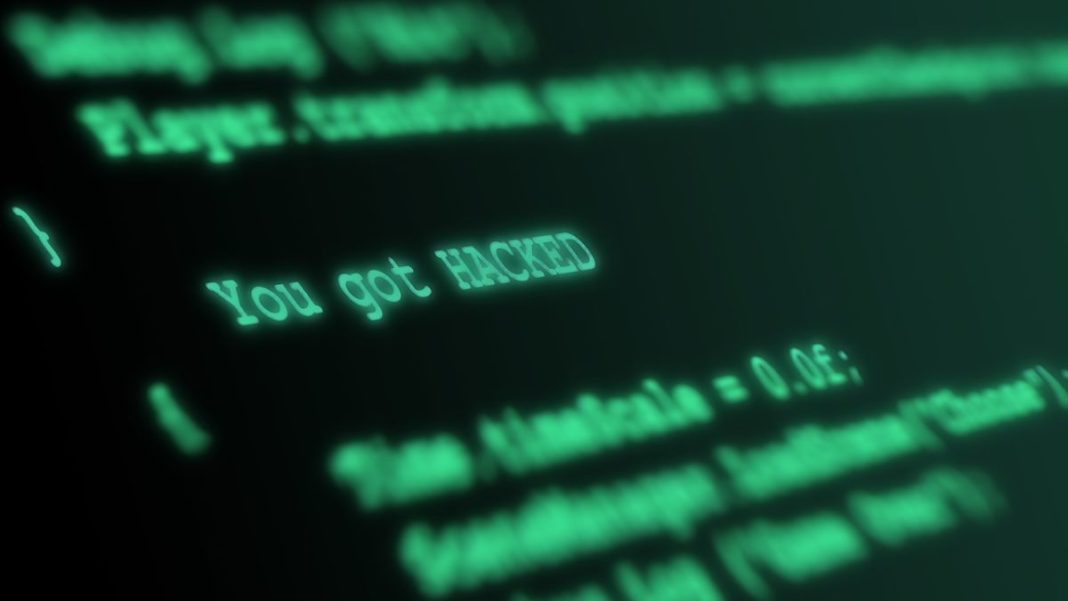 photo of black computer screen with green letters representing threats