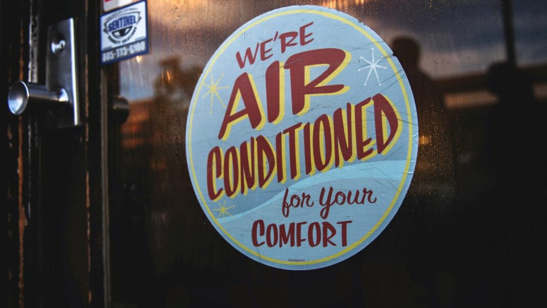 Decal indicating a retail business has functional HVAC inside