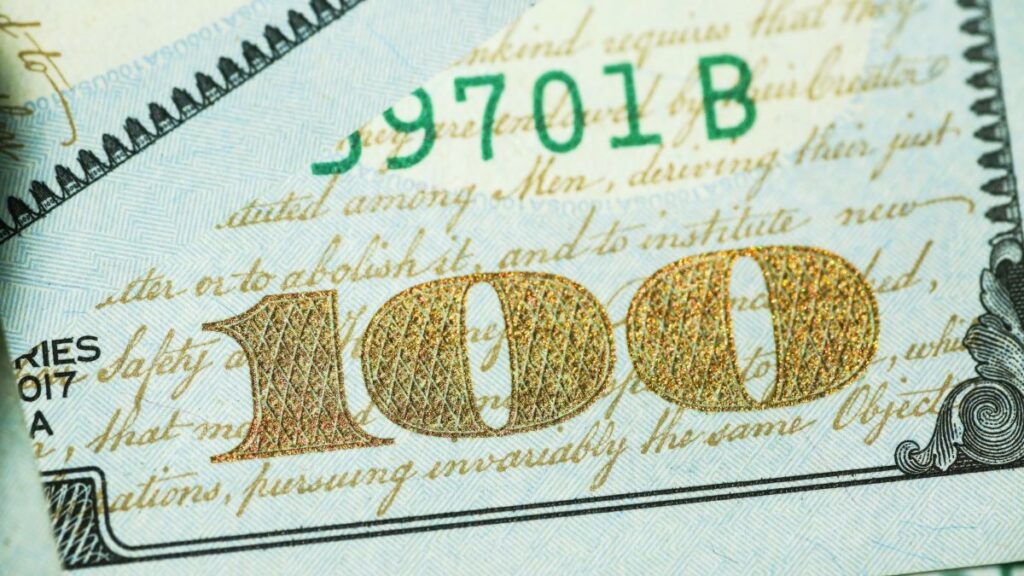 online cash advance represented by a close-up photo of a US one-hundred-dollar bill