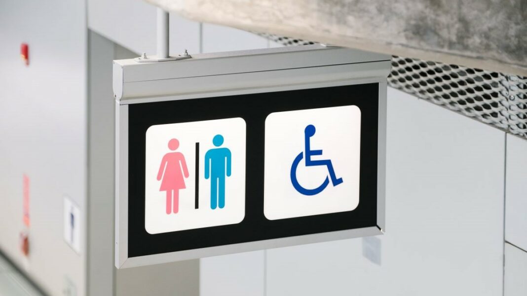 ADA compliance represented by a toilet sign indicating that a public toilet is accessible to individuals with disabilities