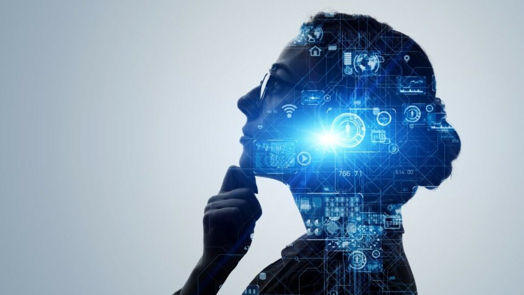 information technology represented by a photograph of a woman's head in silhouette overlaid with computing graphics