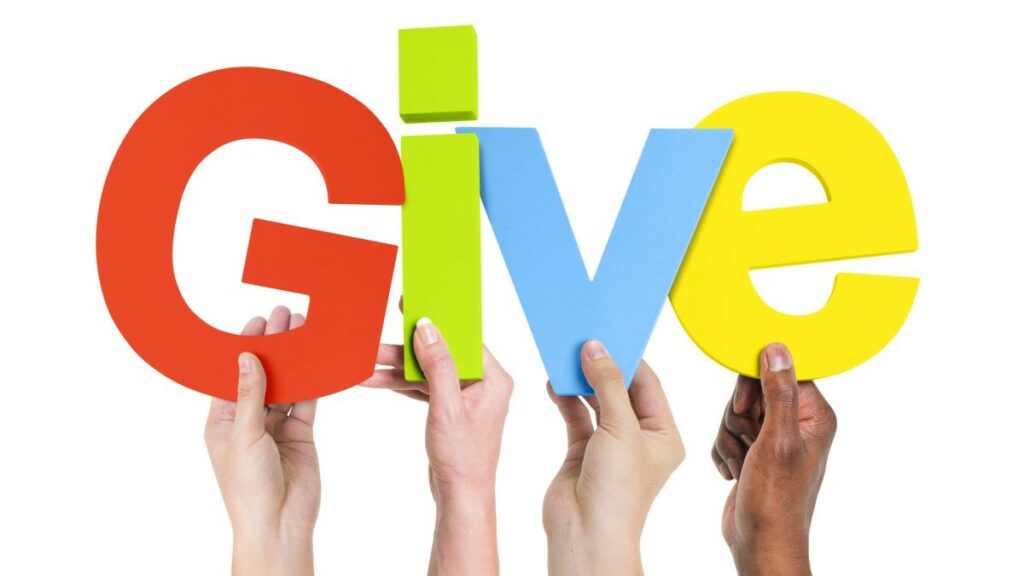 self-employed persons giving to charity represented by diverse hands holding up letters spelling the word "Give"
