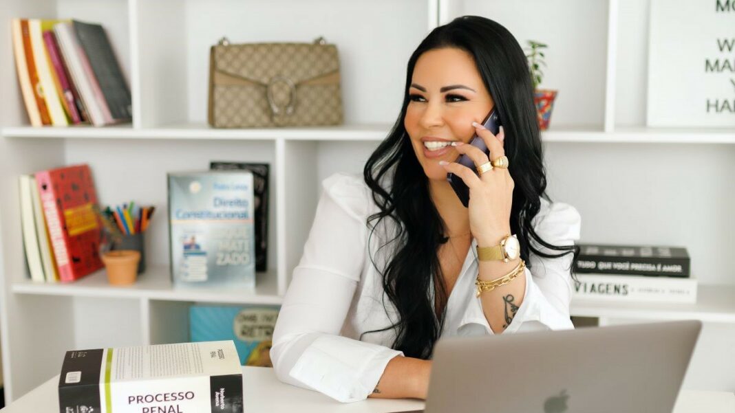 franchise businesses represented by a happy businesswoman talking on the phone in a bright and cheery office