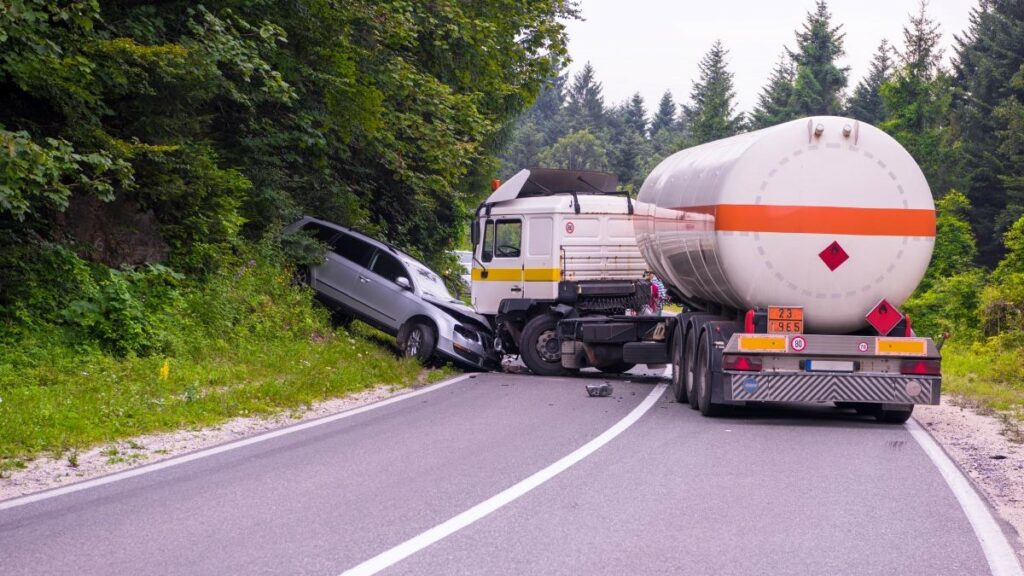 auto accident legalities represented by a photo of a collision between a tanker and an automobile