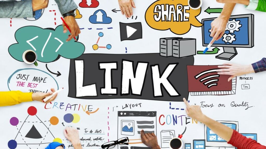 backlink profile represented by people's hands hovering over a large piece of artwork depicting the concepts around link-building