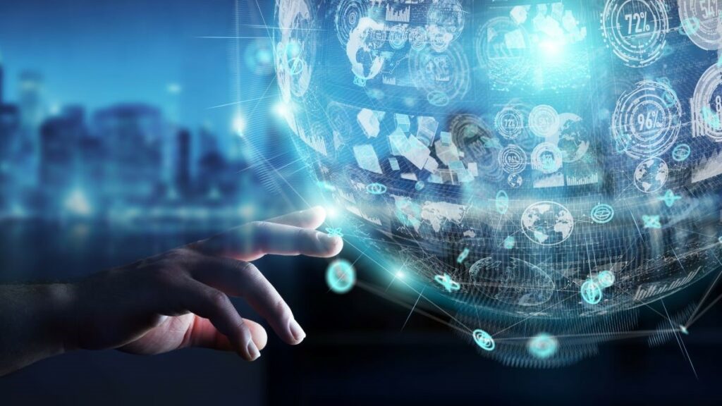 loan management software represented by a business person's hand against a blurred background as they choose from icons on a holographic globe