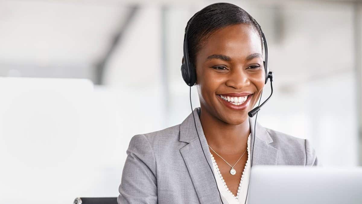 contact center operations represented by a smiling customer support representative